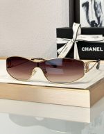 Chanel Logo Rhinestone Shield Sunglasses in Gold | Chicly Hub